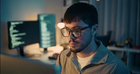 Focused Programmer Working Late in Tech Office at Night. Stock Footage 306739321