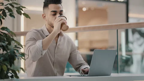 Focused responsible young guy typing business email sit at table freelancer Stock Footage 170195101