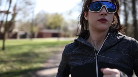 Focused run in green park Video stock 333560839