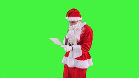 Focused Santa Claus reading letters from children requesting their favorite.. Stock Footage 285348344