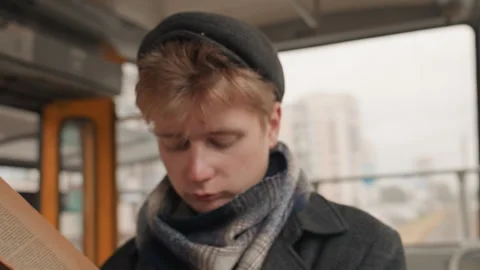 Focused scholarly reading. Gentle illumination highlights thoughtful scholar Stock Footage 345165535