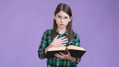 Focused schoolkid red dictionary story isolated vivid color background Stock Footage 170590518