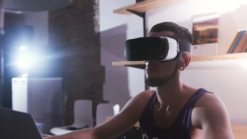 Focused scientist wearing virtual reality headset looking straight. Portrait of Stock Footage 98178341