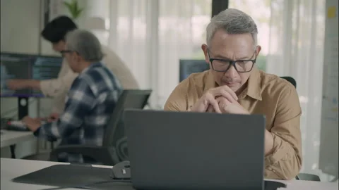Focused Senior Professional Working In Technology And Programming Environment Stock Footage 308232714