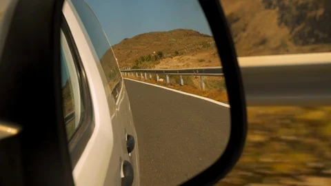 Focused Shot of the Road from a Car Side View Mirror 스톡 동영상 116562445