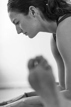 Focused Side Profile During Yoga Stretch Fotos de archivo