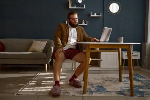 Focused smart guy geek expert working online Stock Photos