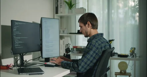 Focused Software Developer Working on Code in Modern Home Office. Stock Footage 306738058