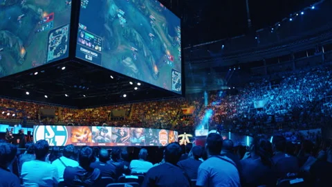 Focused spectators watching the League of Legends Esports Final at stadium. Stock Footage 154354202