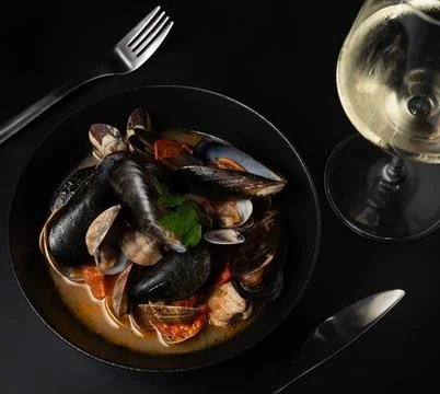 Focused Spoon on Dark Dining Surface Stock Photos