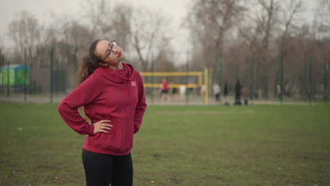 Focused Sprinter Warms Up Energizing, Grass Field Athlete In Preparation Pose Video stock 329522786