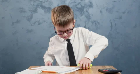 Focused student in glasses staples sheets pleased with result Stockbeeldmateriaal 304363796