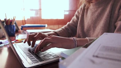 Focused student typewriting on a laptop.  Stock Footage 145811411