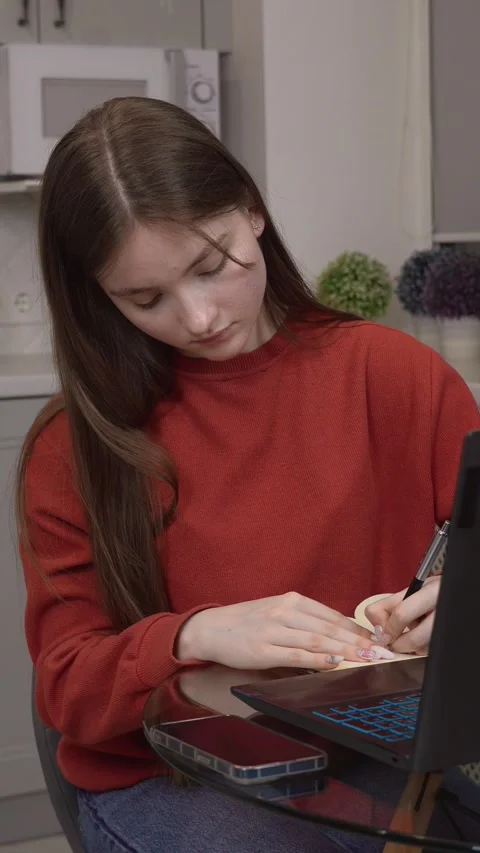 Focused student typing on laptop, studying at home Stock Footage 311780796
