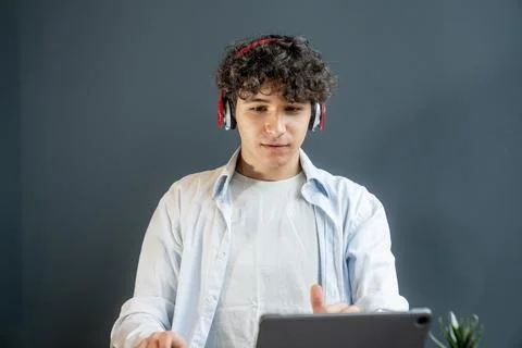 Focused Student Using Tablet for Online Learning and Digital Education Stock Photos
