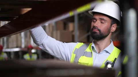 Focused supervisor taking inventory in storehouse Stock Footage 161950745