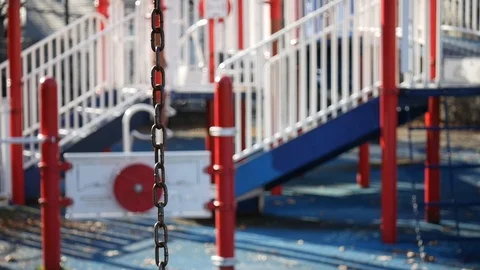 Focused swing sets at the park Stock Footage 122486771