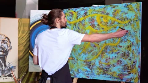 Focused talented artist working on abstract painting, create emotional art. Video stock 238596830