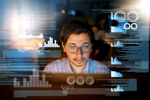 Focused on the task. Shot of a computer programmer looking through data in th Foto stock