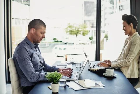 Focused on the tasks at hand. two colleagues working in their office. Foto stock