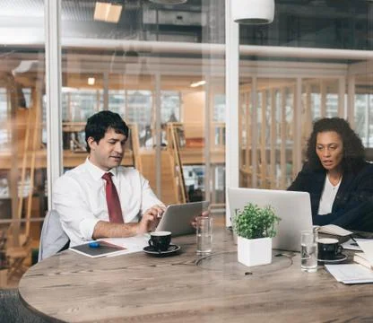 Focused on technology in the office Stock Photos