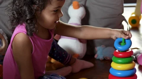 Focused Toddler Playing with Stacking Rings Video stock 318547428