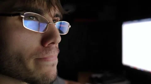Focused trader analyzing cryptocurrency market trends on computer screen Video stock 321738977
