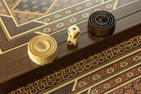 Focused View Of Intricate Backgammon Board With Poised Dice During Tense Game Stock Photos