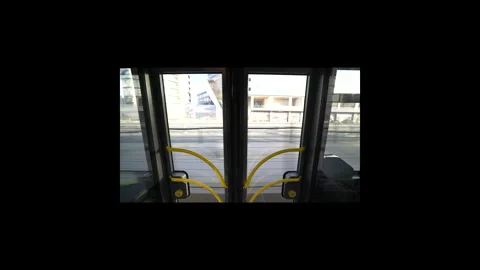 A focused view of open tram doors reveals rushing outside views Stock Footage 318798715
