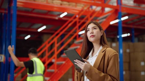 Focused Warehouse Manager Using Tablet. Stock Footage 278431408