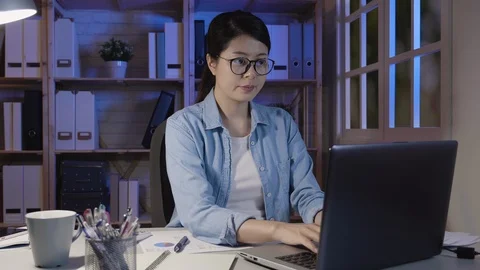 Focused woman looking at laptop computer screen Stock Footage 101672446