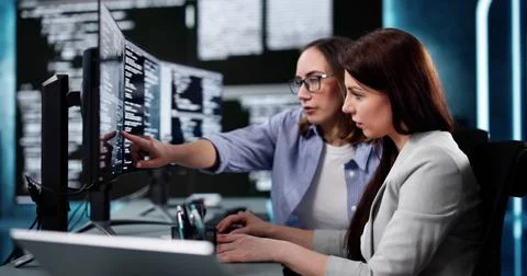 Focused Woman Programmer Developing Software Code On Computer Screen Stockfoto's