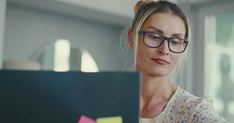 Focused Woman Working on Computer in Modern Office Stock Footage 323586134