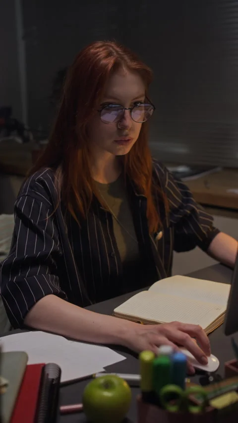Focused Woman Working Late on Computer in Office at Night Stock Footage 338418741