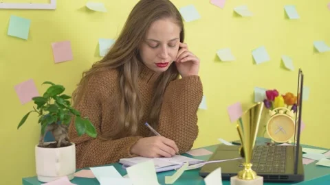 Focused Woman Writing Notes in Notebook Concentration Moment Stock Footage 306658513