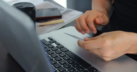 Focused work scene. Person verifying bill with laptop. Individual handling Vidéo 344739719