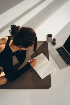 Focused Work Session on Yoga Mat Stock Photos