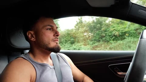 Focused Young Athletic Man Driving Luxury Car on Highway Road Trip Transport Vídeo Stock 347200168