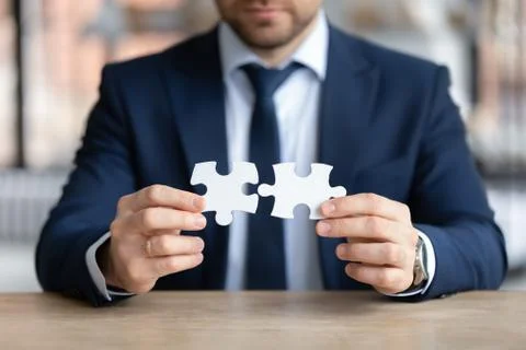 Focused young businessman finding difficult problem solution. Stock Photos