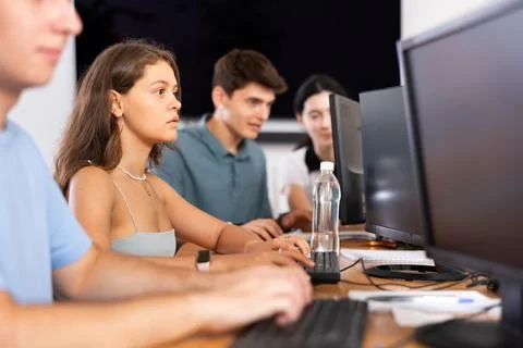 Focused young female software developer working in IT startup Foto stock