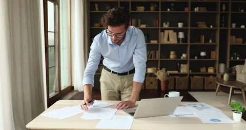 Focused young man analyze stat data working from home office Stock Footage 170655466