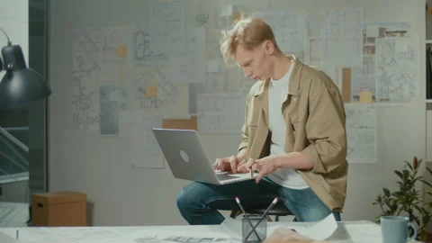 Focused Young Man Architect Typing on Laptop Doing Research at Office. Video stock 239105393