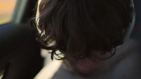 Focused Young Man in Glasses and Headphones in Car Stock Footage 346355662