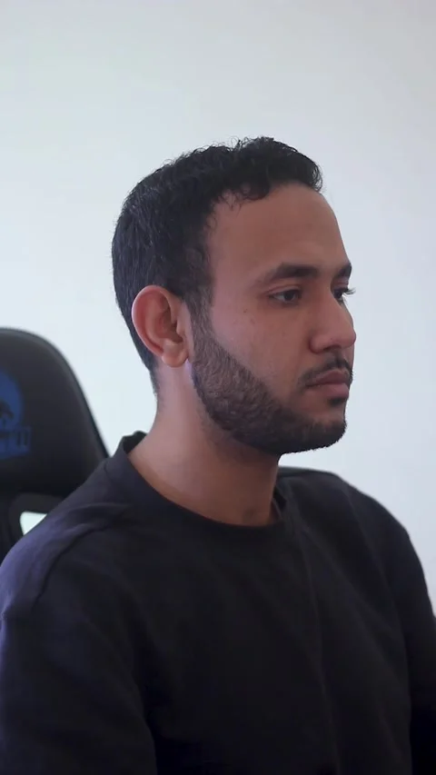 Focused Young Man Sitting at Desk Working on Computer in Home Office Stock Footage 340294816