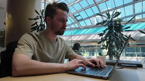 Focused young man working at laptop computer at office workplace, timelapse Stock Footage 279087461