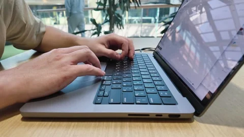Focused young man working at laptop computer at office, timelapse, close-up Vídeo Stock 279087472