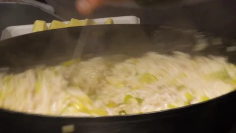 Focusing on the Art of Cooking Risotto 스톡 동영상 322951525