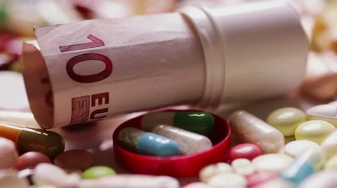 Focusing on bill in pills Stock Footage 6740836