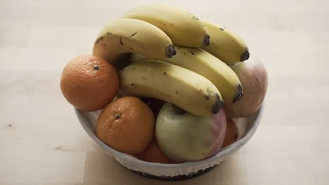 Focusing on Bowl of Fruit Stock Footage 99992268