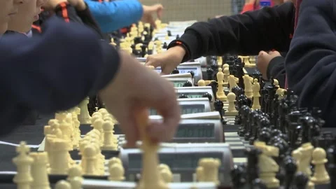 FOCUSING CHILDS HAND PLAYING CHESS Stock Footage 100199505